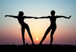 Silhouette of two young women Silhouette of two young women