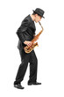 Full length portrait of a young man playing on saxophone Full length portrait of a young man playing on saxophone
