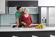 young couple have fun in modern kitchen