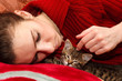 Photo: young woman sleeping with kitten young woman sleeping with kitten