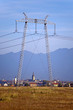 Electricity pylon and city in background Electricity pylon and city in background