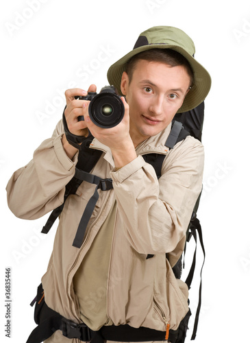 Photo: young man dressed in a tourist young man dressed in a tourist