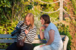Ladies doing photography and chatting.