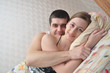 happy young couple in bed
