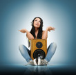 Young beautiful girl in headphones with wooden speaker Young beautiful girl in headphones with wooden speaker