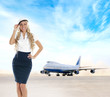 Sexy stewardess over background of airport
