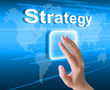 hand pushing strategy button on a touch screen interface