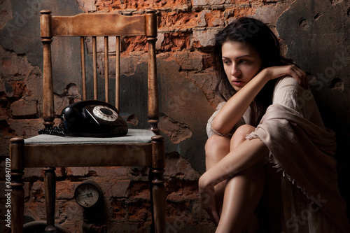 Photo: Woman with the old phone Woman with the old phone