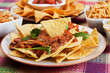 Nachos, corn chips with chili sauce Nachos, corn chips with chili sauce
