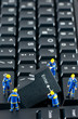Team of construction workers working on a computer keyboard Team of construction workers working on a computer keyboard