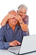 Seniors couple using a computer laptop