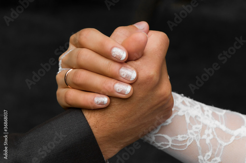 Photo: Hands of a groom and a bride Hands of a groom and a bride