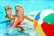 Children swimming in pool.