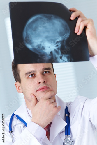 Photo: doctor with X-ray picture doctor with X-ray picture