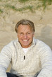 Photo: A happy smiling man in his forties. A happy smiling man in his forties.