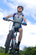 Person riding a bike downhill style Person riding a bike downhill style