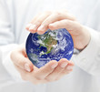 Photo: Globe in hands Globe in hands