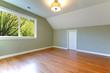 Green fresh empty room with view of trees and oak floor.