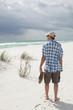 Foto: Mature Man walking on the beach Mature Man walking on the beach