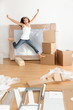 New home - moving woman excited