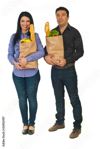 Photo: Full length of couple with shopping food Full length of couple with shopping food