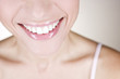 A young woman smiling, close-up