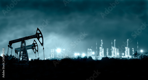 Photo: Pump jack and grangemouth refinery at night. Pump jack and grangemouth refinery at night.