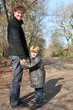 Father and son taking a walk in the woods