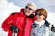 old couple skiing