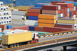 truck transports container to warehouse near the sea