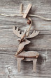 Wooden christmas deer on wooden background