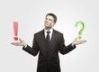 Businessman with a question and exclamation mark