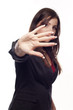 Young pretty businesswoman making stop sign