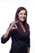 Smiling woman operator with headset showing hand ok sign