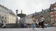 People relax in front of  fountain
