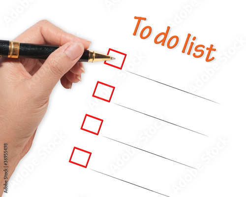 Photo: female hand checking to do list female hand checking to do list