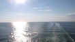 Sun road on surface of water, view from ship