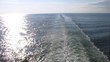 Cruise liner trace on cloudy day, view from ship stern