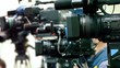 Operator prepare equipment in row of few cameras