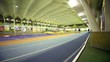 Man runs by track in the gymnasium