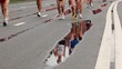 Man naked legs run in jogging shoes on asphalt with puddles
