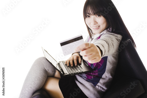 Photo: Chinese student showing off a credit card. Chinese student showing off a credit card.