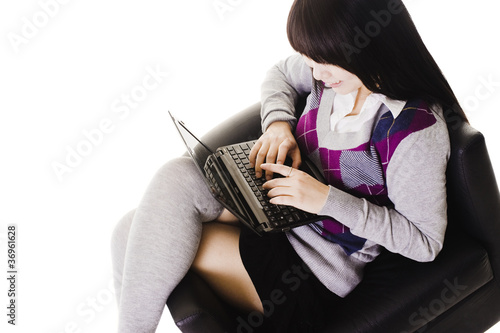 Photo: Chinese student working on a laptop. Chinese student working on a laptop.