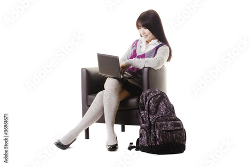 Photo: Chinese student working on a laptop. Chinese student working on a laptop.