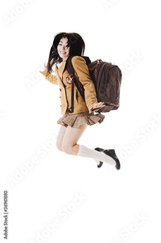 Photo: Chinese school girl jumping in the air. Chinese school girl jumping in the air.