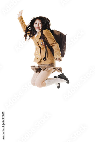 Photo: Chinese school girl jumping in the air. Chinese school girl jumping in the air.