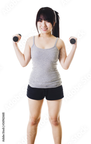 Photo: Chinese girl lifting hand weights. Chinese girl lifting hand weights.