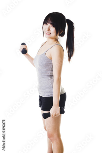 Photo: Chinese girl lifting hand weights. Chinese girl lifting hand weights.