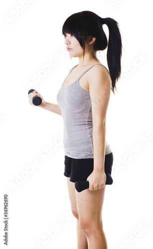 Photo: Chinese girl lifting hand weights. Chinese girl lifting hand weights.