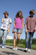 kids walking around in the countryside
